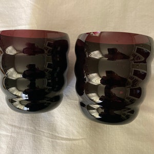 Two Matching Ribbed Glass Purple Vases
