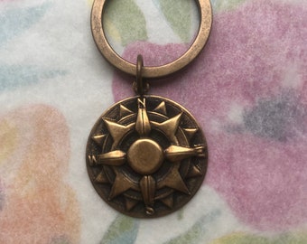 Ke-3 Keyring with brass compass charm; one-sided lightweight brass stamping. Free shipping.