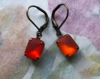 Ea-213 Earrings. Orange, Fiery Earrings. Rectangular Matte-glass set stones. Brass lever backs with shell adornment. Free Shipping.