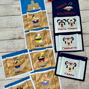 May include: A set of six personalized beach-themed fabric storage organizers with a blue and tan color scheme. Each organizer features a different character from Disney's Mickey Mouse and a name. The organizers are perfect for storing small items like toys, books, or clothes.