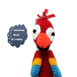 May include: Red, yellow, and blue crocheted finger puppet of a parrot with large white eyes and a black beak.