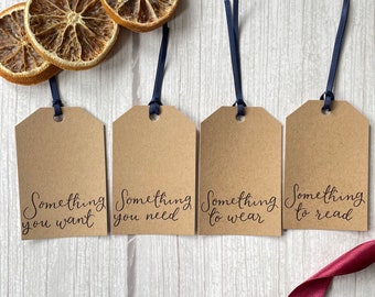 Set of 8 Christmas gift tags in 4 rhyming hand lettered calligraphy designs | something you want, need, something to wear, read- minimalist