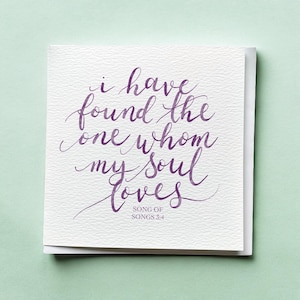 May include: A white greeting card with purple calligraphy that reads "i have found the one whom my soul loves." The text is from Song of Songs 3:4. The card is on a light green background.