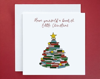 May include: A white card with a red inscription that reads "Have yourself a bookish little Christmas". A colourful illustration of a Christmas tree made of stacked books with a yellow star on top.