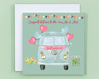May include: A light blue vintage van with a "Just married" banner and pink hearts attached to the back. The van is on a light green background with a banner that reads "Congratulations to the new Mr. & Mrs."