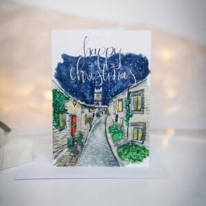 Carte de Noël imprimée avec une illustration aquarelle d'Édimbourg hivernale festive
