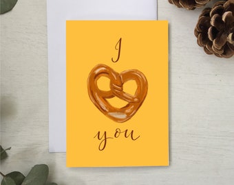 I heart you, I love you, pretzel baked good, bakery yellow Mother’s Day card, anniversary card, romantic love card