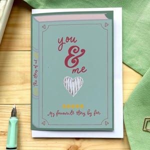 Tarjeta romántica para amantes de los libros: tarjeta para el día de San Valentín, tarjeta de aniversario con portada de libro: tú y yo en azul cielo, tarjeta de felicitación con una historia de amor