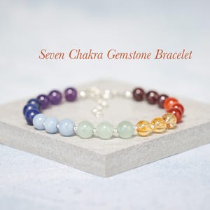 May include: Seven Chakra Gemstone Bracelet with beads in the colours of the rainbow, including amethyst, lapis lazuli, aquamarine, aventurine, citrine, carnelian, and red jasper.
