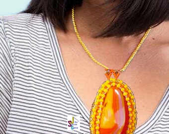 May include: A necklace featuring a large, teardrop-shaped pendant with a smooth, marbled orange and yellow center. The pendant is framed by a border of small, bright yellow beads and hangs from a thin, gold-toned chain. Text reads SJ 7610.