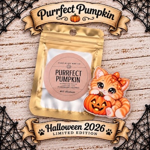May include: A gold-colored resealable pouch containing Purrfect Pumpkin signature putty with a round label, accompanied by an acrylic charm of an orange tabby kitten holding a jack-o'-lantern pumpkin, featuring text Purrfect Pumpkin and Halloween 2026.