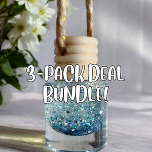 May include: A clear glass air freshener bottle filled with blue glitter and a wooden cap. The bottle is suspended by a brown string. The text "3-PACK DEAL BUNDLE!" is written across the front of the bottle.