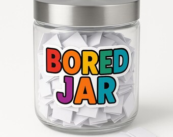 May include: A glass jar with a silver lid, filled with small white paper squares. The jar features a colourful sticker that reads "BORED JAR" in rainbow colours. A few loose paper squares are visible near the jar.