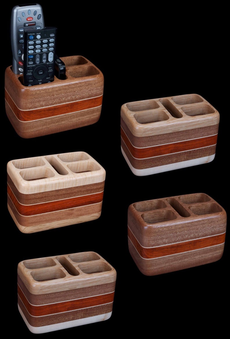 Hardwood remote control holder holds four remotes and smartphone.