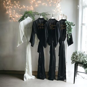 Long black personalized satin bridesmaid robes with front and back gold text. Custom gifts for Mother of the Bride, Groom and Bridal party. image 1