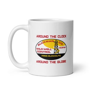 May include: White ceramic mug with a red and yellow logo that reads "Around the Clock Buckman Co. Wild Well Control Fires-Blowouts Around the Globe".