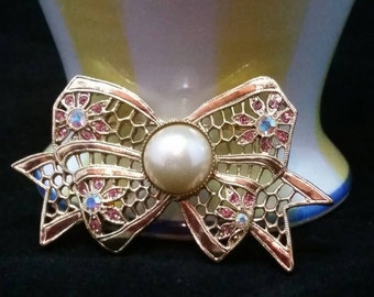 1928 Jewelry Company Bow Brooch Faux Pearl Center with Rhinestones Vintage Jewelry Aurora Borealis