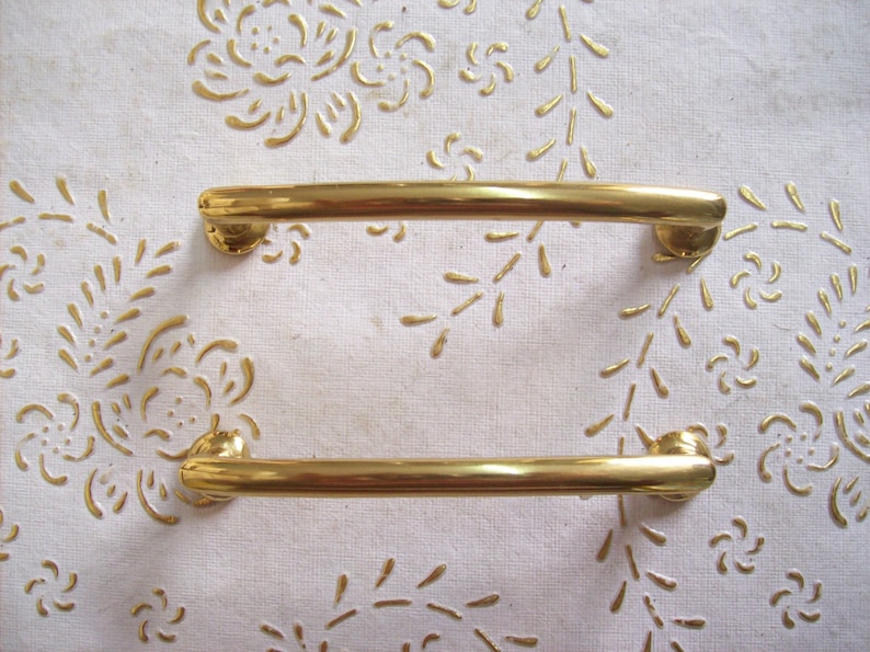 art.594 9,6 polished handle gold 8 cm hole spacing Italy Brass handles in high quality handle gold.Pulls gold length mm.111 diameter mm