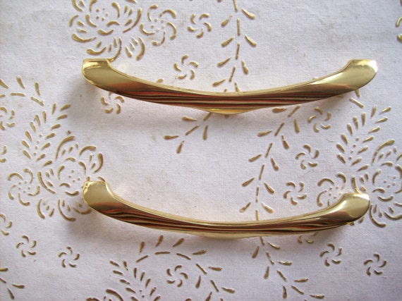 art.594 9,6 polished handle gold 8 cm hole spacing Italy Brass handles in high quality handle gold.Pulls gold length mm.111 diameter mm