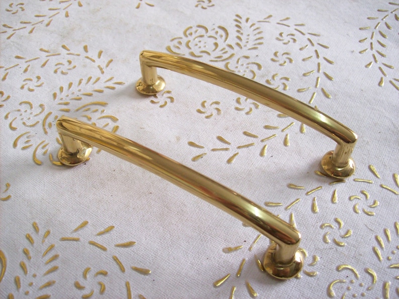 art.594 9,6 polished handle gold 8 cm hole spacing Italy Brass handles in high quality handle gold.Pulls gold length mm.111 diameter mm