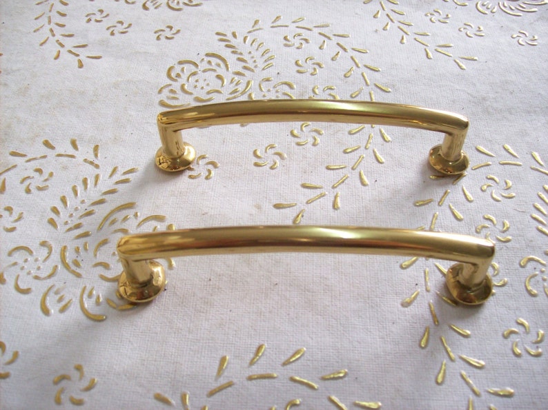 art.594 9,6 polished handle gold 8 cm hole spacing Italy Brass handles in high quality handle gold.Pulls gold length mm.111 diameter mm