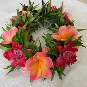 coral plumeria and red orchid haku lei po’o