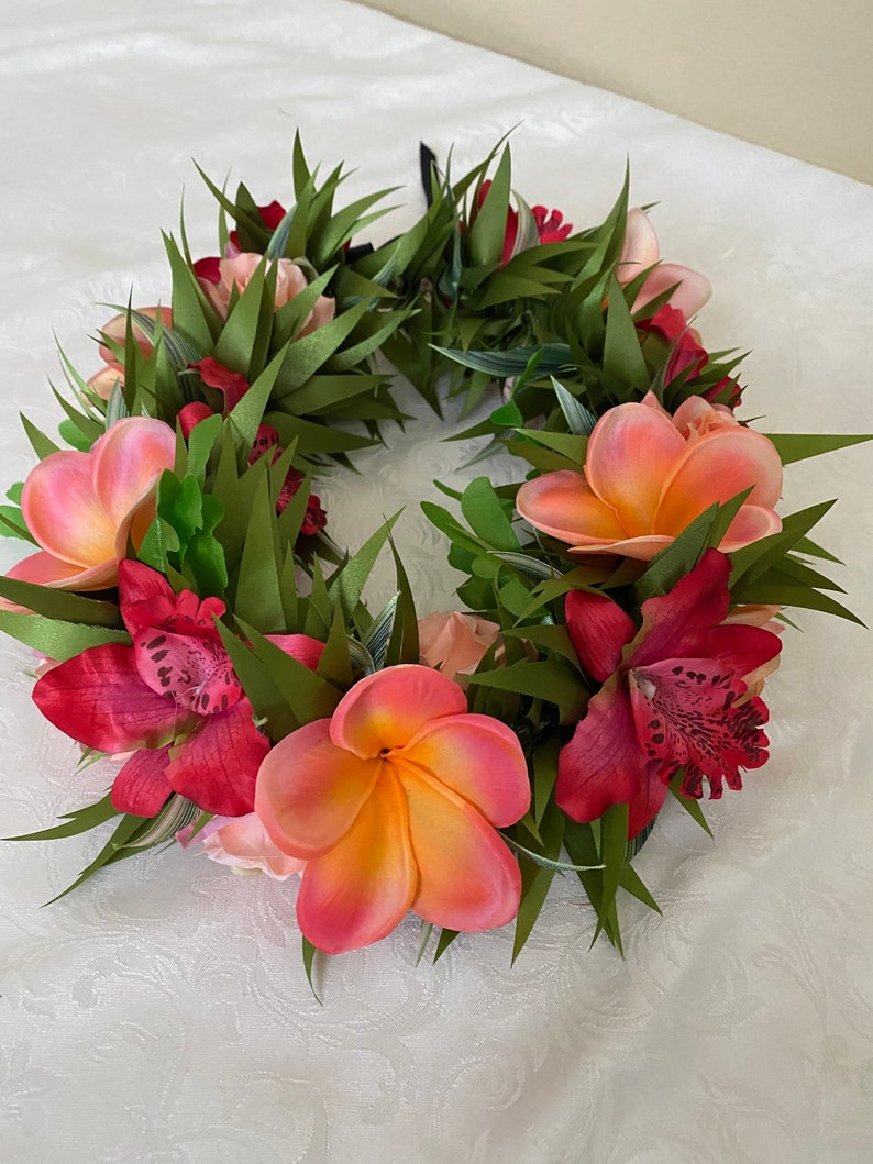 coral plumeria and red orchid haku lei po’o 