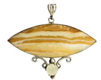 May include: A silver pendant with a large, oval-shaped, banded stone in shades of yellow and cream. The stone is set in a silver frame with decorative flourishes and a loop for a chain. The pendant is approximately 3 inches long.
