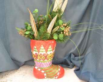 Large ceramic Christmas Boot home decorating. Colorfully and interestingly decorated.