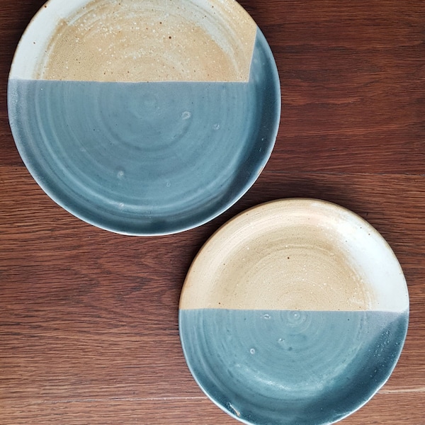 Vintage duo of hand thrown ceramic flat serving  plates with two toned glaze in blues and creams