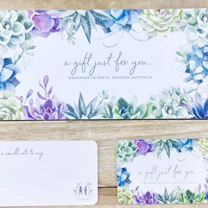 May include: A set of gift cards and a gift tag with watercolor succulent designs in shades of blue, green, and purple. The cards have the text "a gift just for you..." and "handmade in Perth, Western Australia."