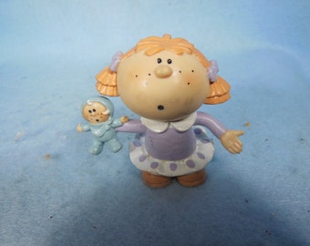 Vintage-Bumpkins Doll-Holding A Doll-George gut-1985