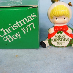 Vintage-Joan Walsh Anglund-Boy-Holding A Wreath Dated 1977