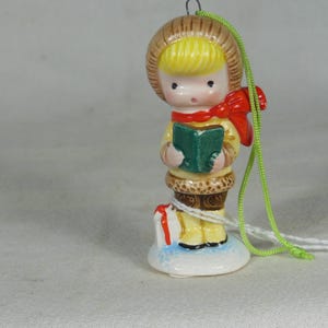 Vintage-Joan Walsh Anglund-Boy Holding A Book and Singing--Has A Gift By His Foot