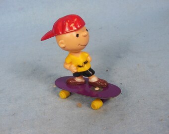 Vintage-Charlie Brown On A metal Skateboard-Aviva-United Feature Syndicate