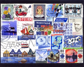 May include: A collection of vintage Dutch postage stamps featuring various designs, including a windmill, a bicycle, a lighthouse, and a portrait of Vincent van Gogh. The stamps are arranged in a collage-like pattern on a white background.