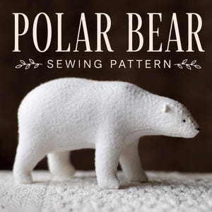 May include: A white felt polar bear figurine with visible stitched seams along the back and head. Above the bear, the text reads POLAR BEAR SEWING PATTERN in a serif font, accented by small decorative leaf illustrations on either side.