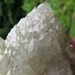 Diane Wilson reviewed A large 2 lb. 3.7oz Candle Quartz (pineapple quartz). Hundreds of terminations covering this large high luster crystal. The tips are smoky