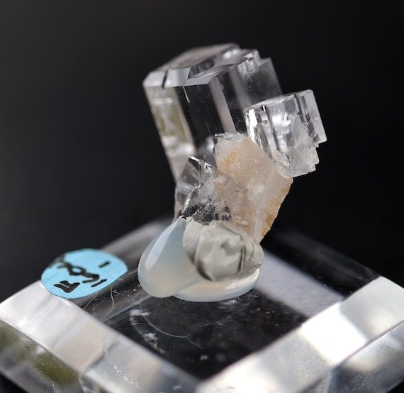 Ice cube Fluorite stepped growth cube with calcite. Llamas Quarry, Asturias, Spain. Ex Philip Phillips collection. No. 1604