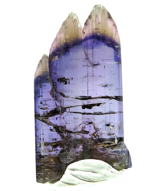 Natural no heat gem Tanzanite 29.5 grams. Merelani in northern Tanzania. Intense pleochroism in polarized light