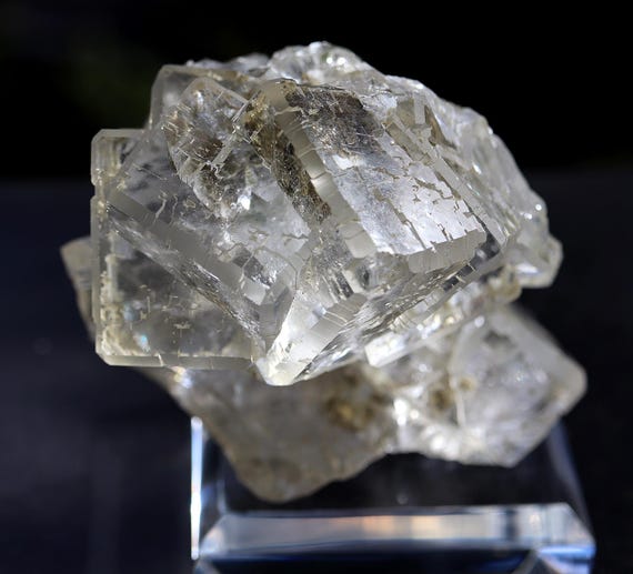 A clear Fluorite fan cluster with large cube modified corners. Dalnegorsk, Primorski Krai, Russia. Cabinet specimen