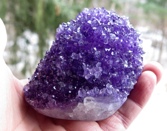 Amethyst stalactite with polished bottom. Sits upright perfectly. Excellent condition. 3.25 inch tall 3.25 inch wide. 1.4 pound Uruguay