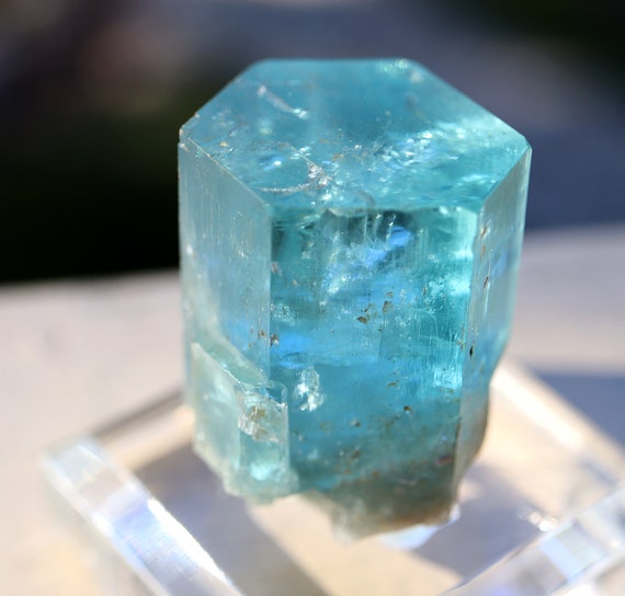 Beryl var. Aquamarine. Amazing blue. 63 grams. Flat termination with a terminated side car. Erongo Mts., Namibia. C. Cecil collection label