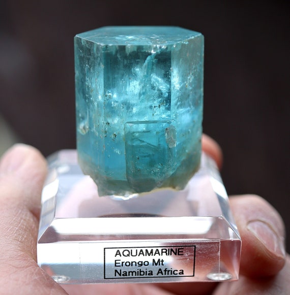 Beryl var. Aquamarine. Amazing blue. 63 grams. Flat termination with a terminated side car. Erongo Mts., Namibia. C. Cecil collection label