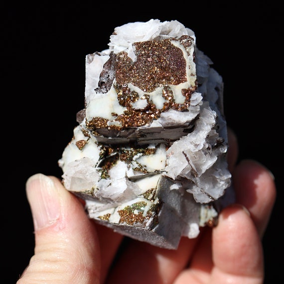 Quartz, iridescent rainbow pyrite, calcite pseudomorph after fluorite, Nikolaerskiy mine, Dalnegorsk, Russia 2.75 inch. See video