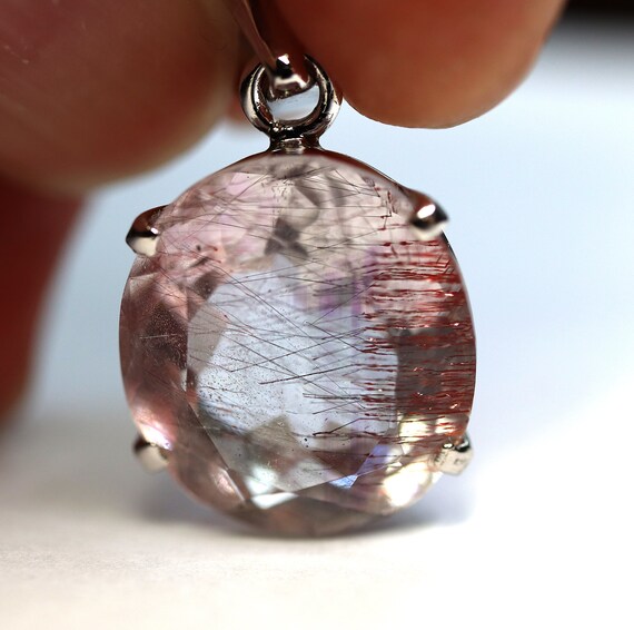 Red and silver Rutile included facet quartz pendant set in 929 silver. Pendant only, no chain