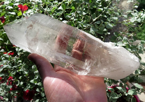 Complete High altitude Himalayan Crystal. Natural with no polishing. 9.75 inch tall. Interesting natural included Feldspar on lower area