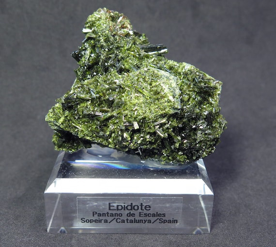 Epidote crystals on matrix. Pantano de Escales, Sopeira Catalunya, Spain. Comes mounted as shown