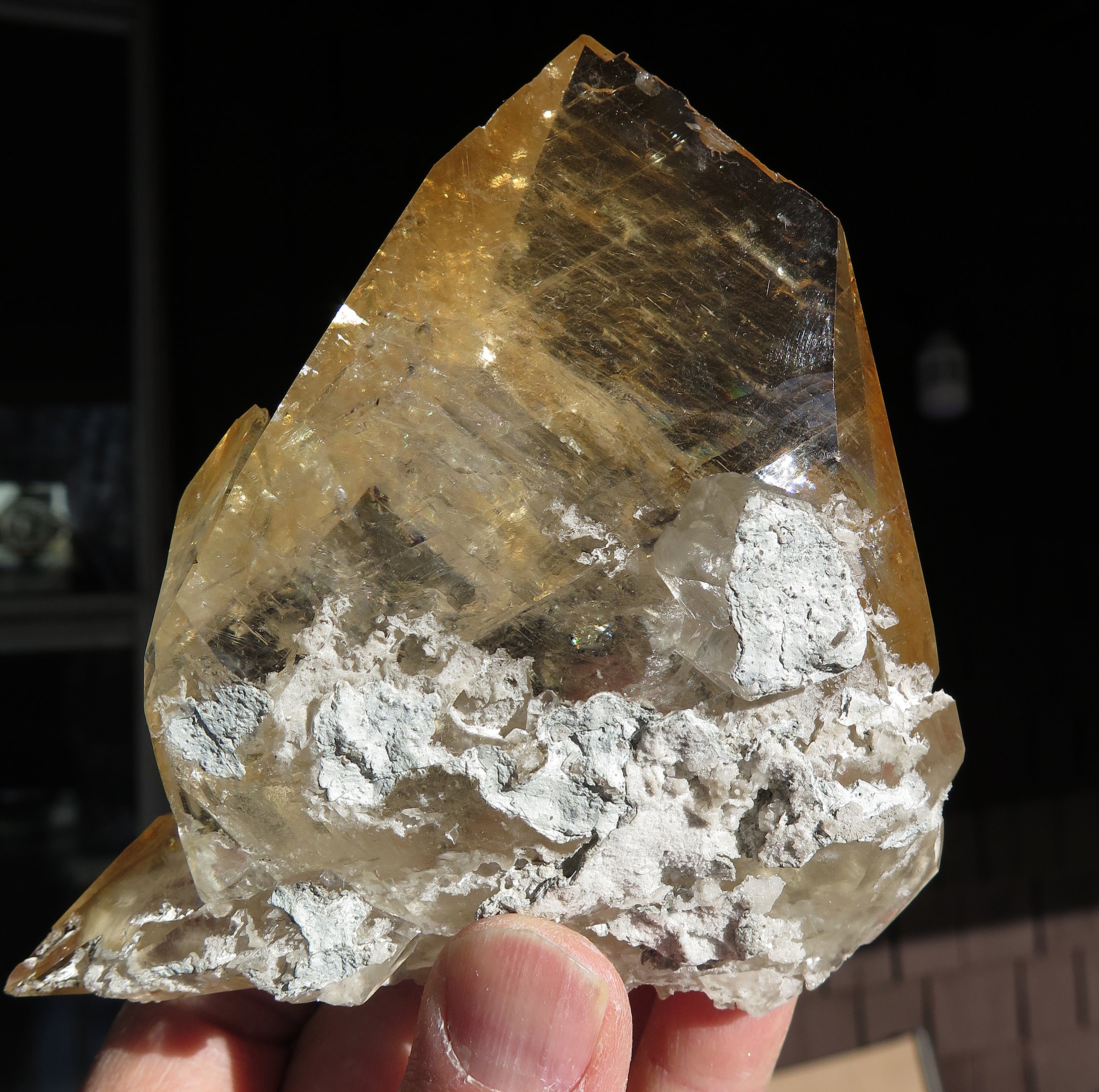 A complete Honey color Calcite Crystal with rainbows in excellent