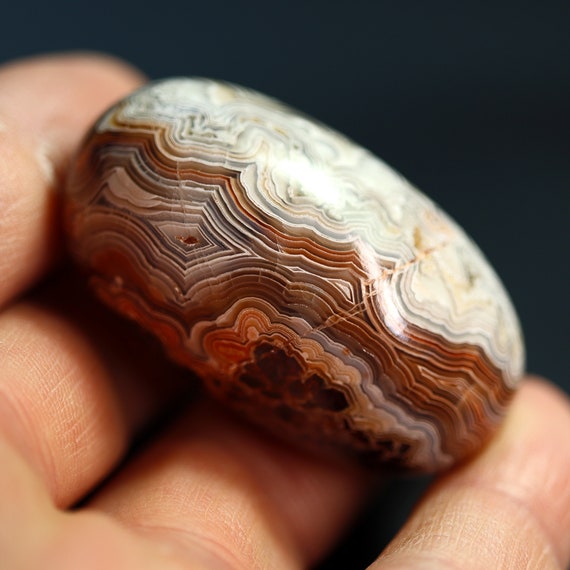 Hand polished Crazy Lace agate. Perfect pocket stone. 2 inch across.